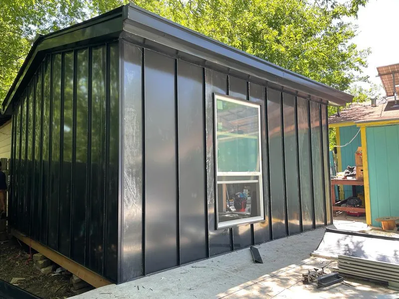 Black standing seam metal wall panels for Roof Inspection in Hilton