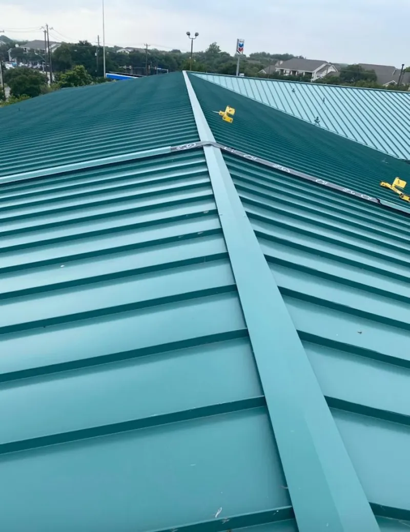 Green commercial metal roof ridge and valley for Metal Roof Repair in Hilton