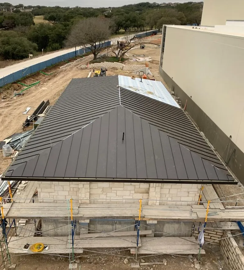 Metal roof new construction with scaffolding in Hilton